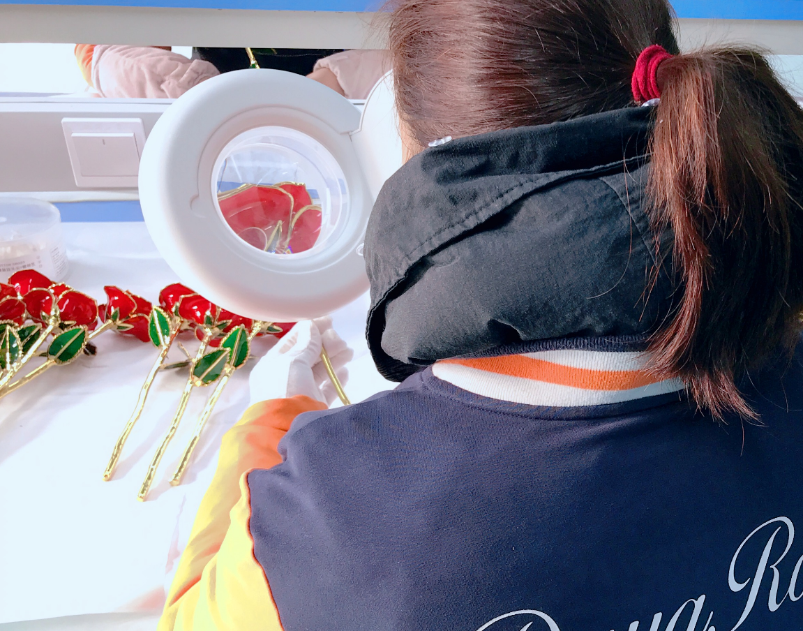 Workers producing natural 24K gold dipped roses in China