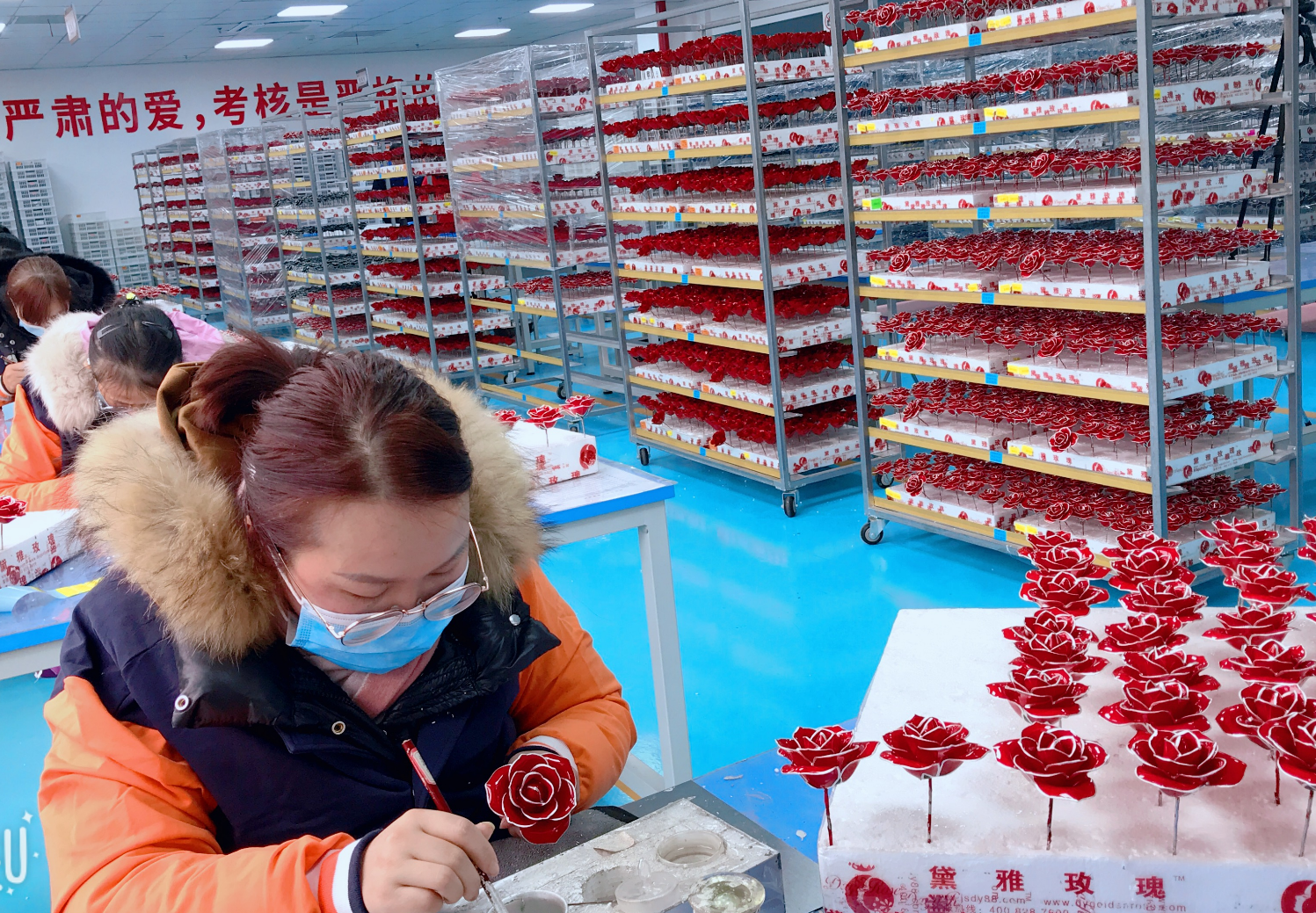 Workers producing natural 24K gold dipped roses in China